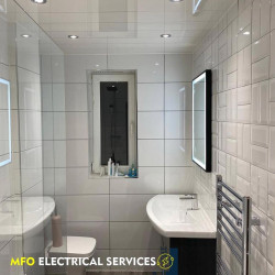 bathroom light lit mirror sink